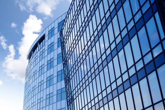 A background surface of modern glass buildings.