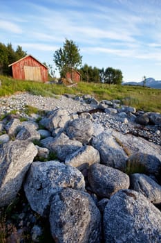 A group of old boat houses on the coast of Norway