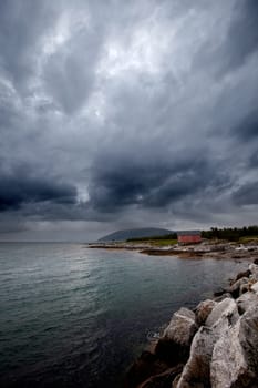A brewing storm on an ocean sunset