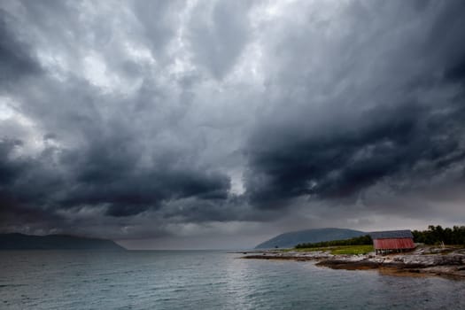 A brewing storm on an ocean sunset