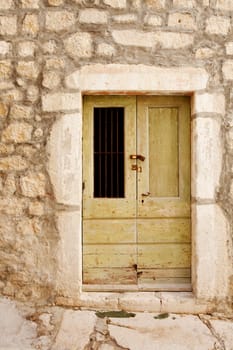 An old wooden door in a stone building