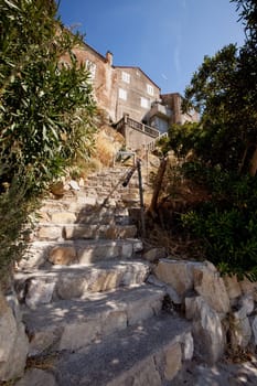 Ols stone stairs leading up to a medieval house in Rab, Croatia