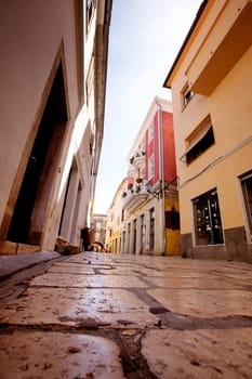 A small pretty street wtih cobblestone in Rab, Croatia