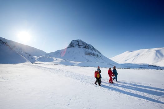 A group of tourists and a guide near Longyearbyen, Svalbard, Norway
