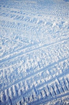A snow texture created on a snowmobile road