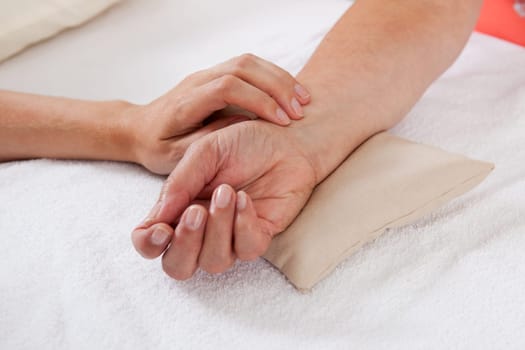 Pulse being taking on a middle aged woman's wrist