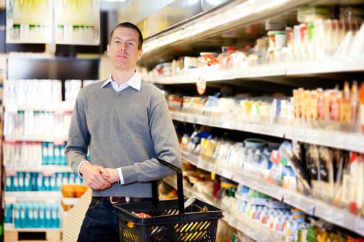 Portrait of a serious customer in a grocery store