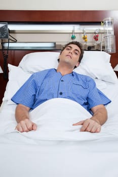An severe male patient at hospital bed