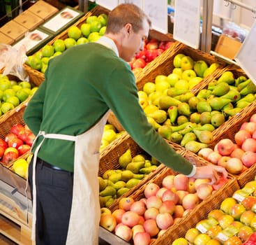 High angle view of store worker working in a grocery store