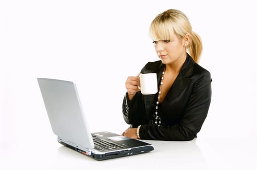 Sexy Beautiful Business women with laptop computer and coffee cup isolated on white