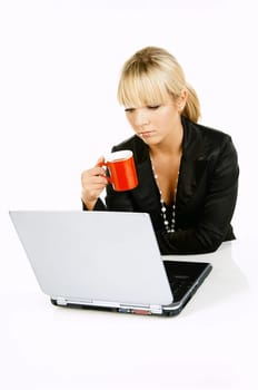 Sexy Beautiful Business women with laptop computer and coffee cup isolated on white