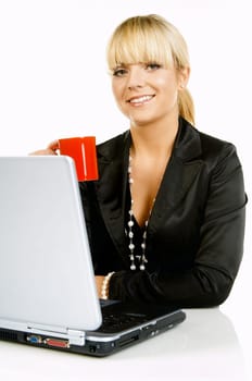 Sexy Beautiful Business women with laptop computer and coffee cup isolated on white