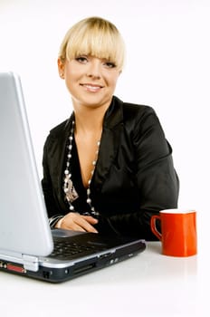 Sexy Beautiful Business women with laptop computer and coffee cup isolated on white