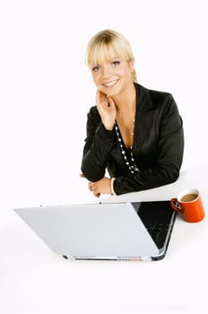 Sexy Beautiful Business women with laptop computer and coffee cup isolated on white