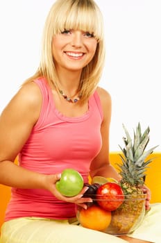 Happy beautiful women with fresh fruits