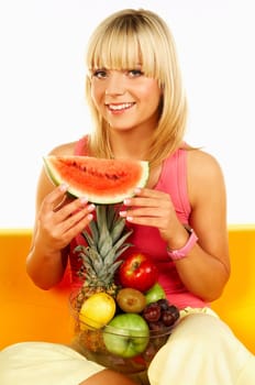 Happy beautiful women with fresh fruits and holding watermelon