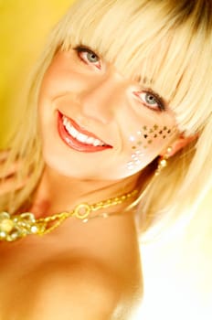 Portrait of beautiful young smiling woman with red lipstick and golden stars on chick