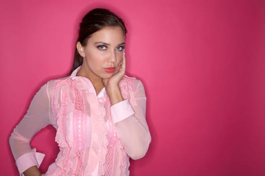 Portrait of Young woman isolated on pink background