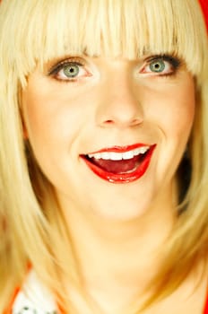 Portrait of beautiful young smiling woman with red lipstick