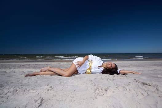 20-25 years old Beautiful Woman on the beach, wearing shirt