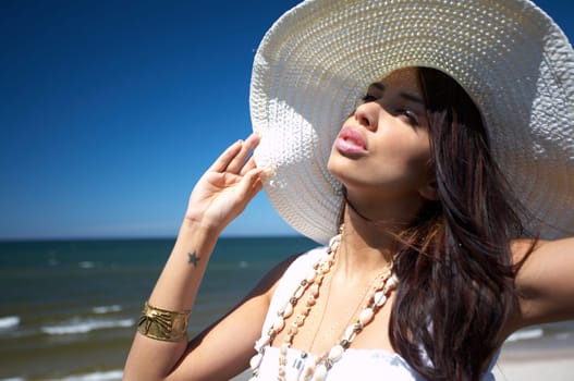 20-25 years old Beautiful Woman on the beach, wearing hat