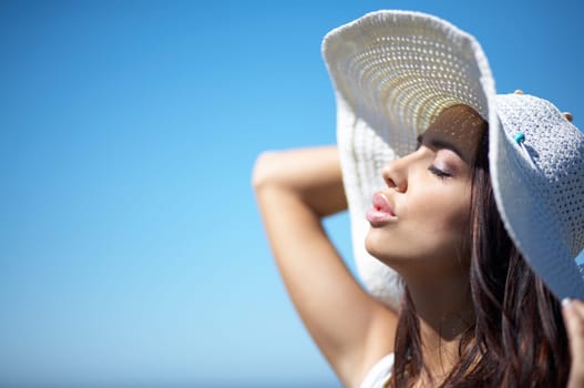 20-25 years old Beautiful Woman on the beach, wearing hat