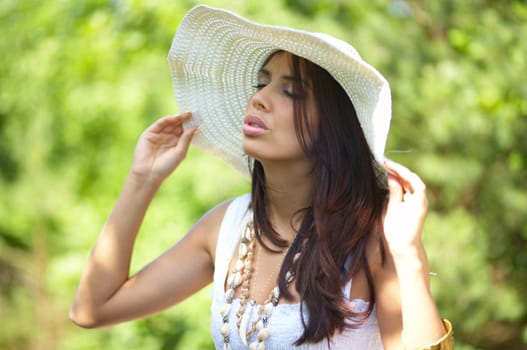 20-25 years old beautiful woman wearing hat, at outdoor
