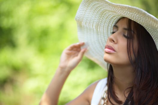 20-25 years old beautiful woman wearing hat, at outdoor