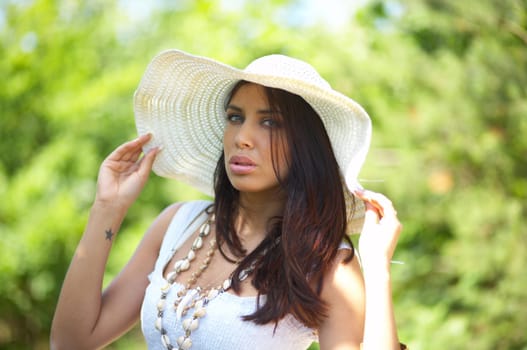 20-25 years old beautiful woman wearing hat, at outdoor