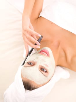 Portrait of beautiful woman during spa treatment