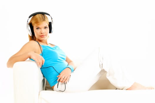 Young beautiful happy women listening music in headphones