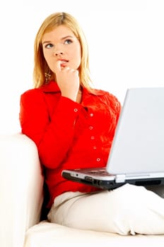 Young pretty women on couch relaxing and using laptop computer