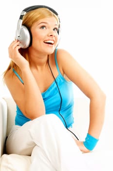 Young beautiful happy women listening music in headphones