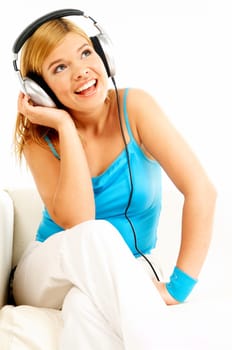 Young beautiful happy women listening music in headphones