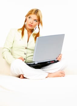 Sexy blonde busiess woman using laptop computer