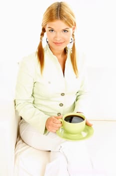 Portrait of attractive beautiful young woman with green cup od black coffee