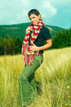 Young business woman relaxing on mountain meadow