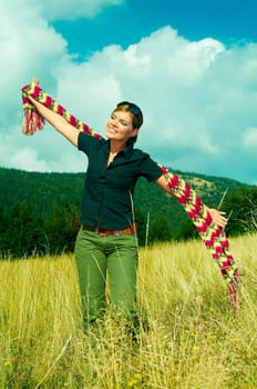 Young business woman relaxing on mountain meadow