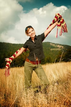 Young business woman relaxing on mountain meadow