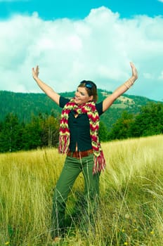 Young business woman relaxing on mountain meadow