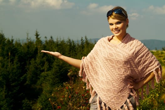 Young business woman relaxing on mountains outdoors