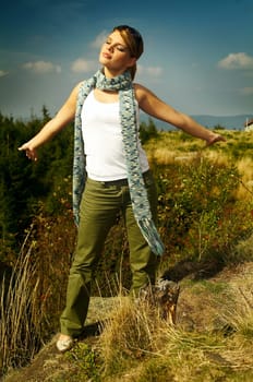 Young business woman relaxing on mountains outdoors