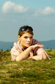 Young business woman relaxing on mountains outdoors