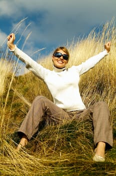 Young beautiful model posing in mountain outdoor scenery