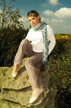 Young business woman relaxing in mountains outdoors