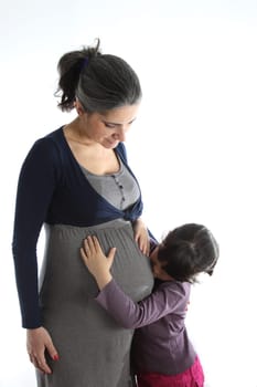 details of a Pregant woman with her daughter isolated on white