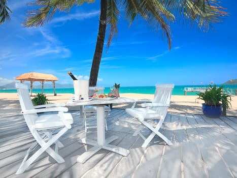 Dining table on the beach close to the ocean