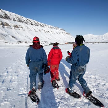 A group of tourists and a guide near Longyearbyen, Svalbard, Norway