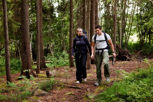 A couple on a hiking camping trip in the forest