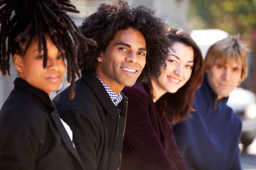 A group of friends in the city - shallow depth of field with focus on African American